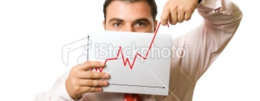 Man holding upward revenue graph.